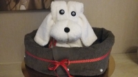 Handdoek creatie puppy In mandje